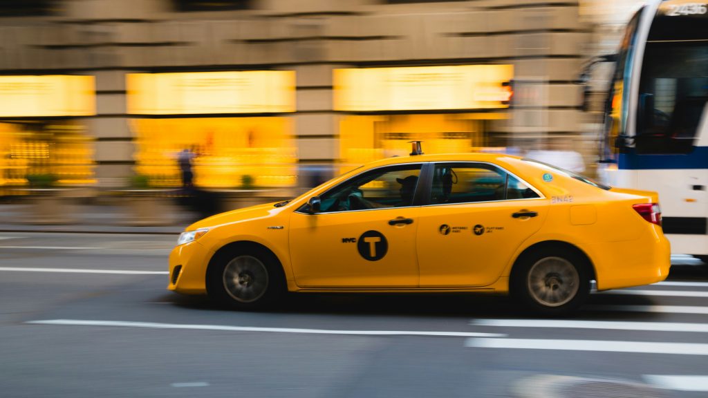 yellow taxi city experience running fast during holidays